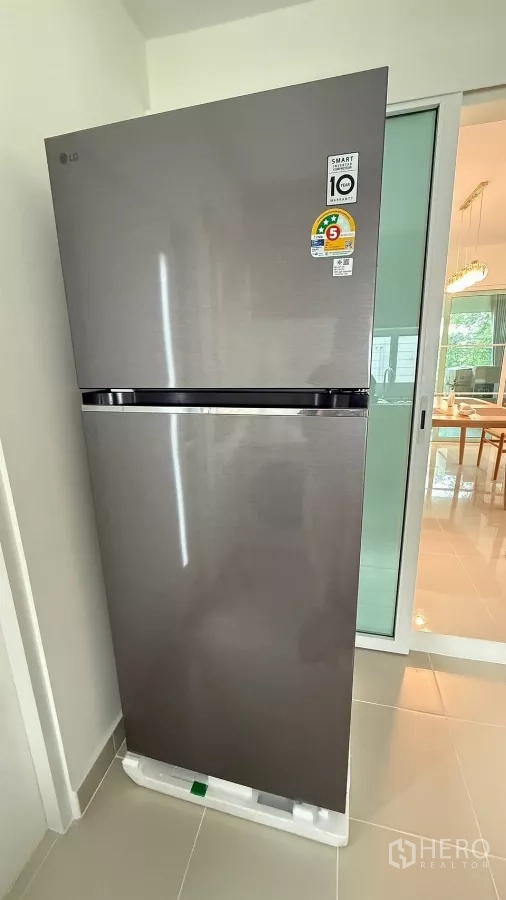 Detached House for rent in Bang Phli, Samut Prakan - Stainless steel two-door refrigerator next to a sliding door.