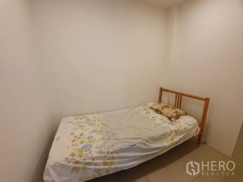 Condominium for rent in Sathon, Bangkok - Compact utility or maid’s room with single bed, white walls and tiled floor.