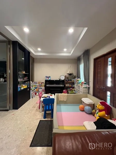 Detached House for rent or sale in Saphan Sung, Bangkok - Multi-purpose family room used as play area with piano and recessed lights.