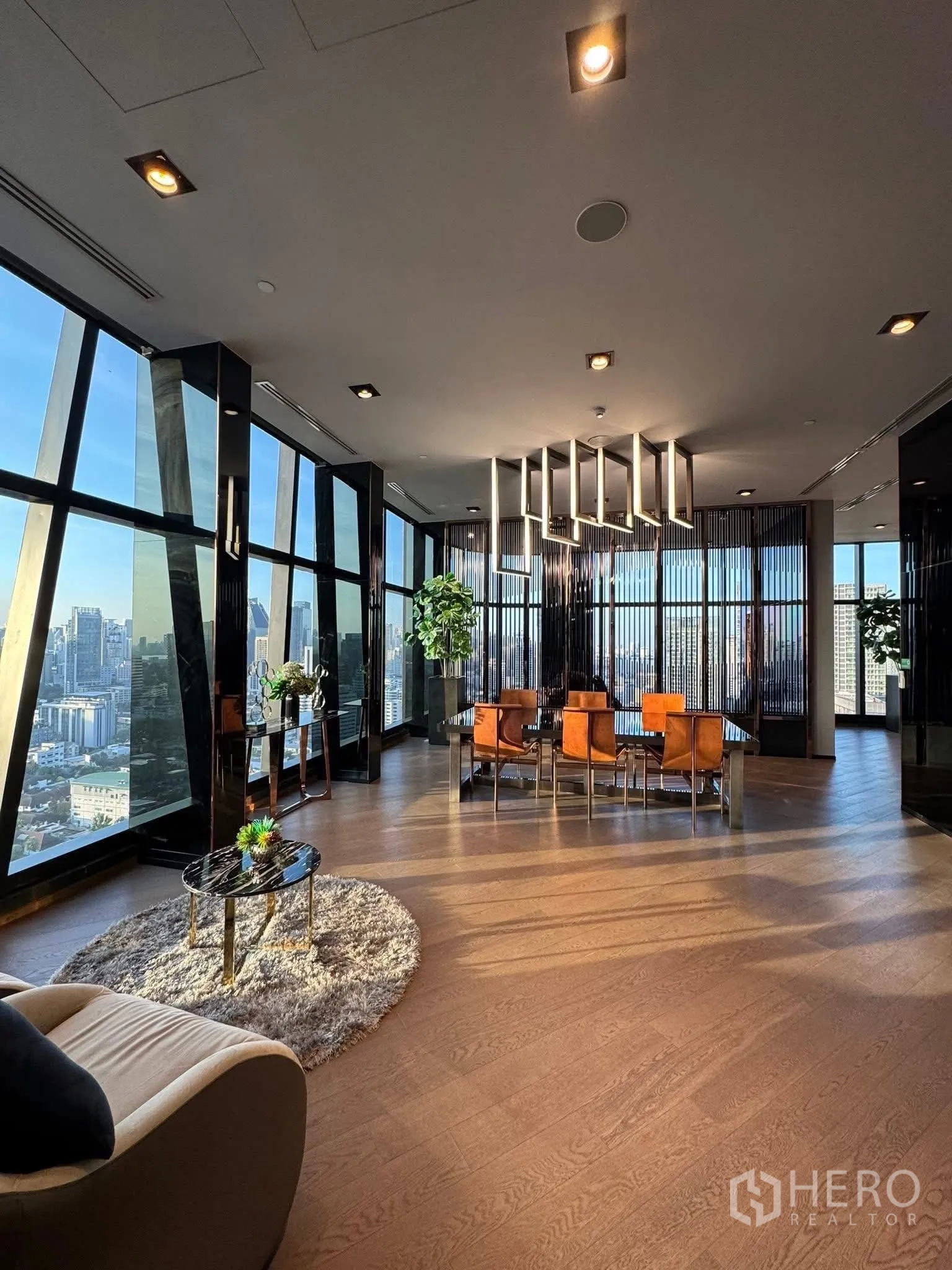 Condominium for rent in Khlong Toei, Bangkok - Elegant dining and co-working room with floor-to-ceiling windows and city views.