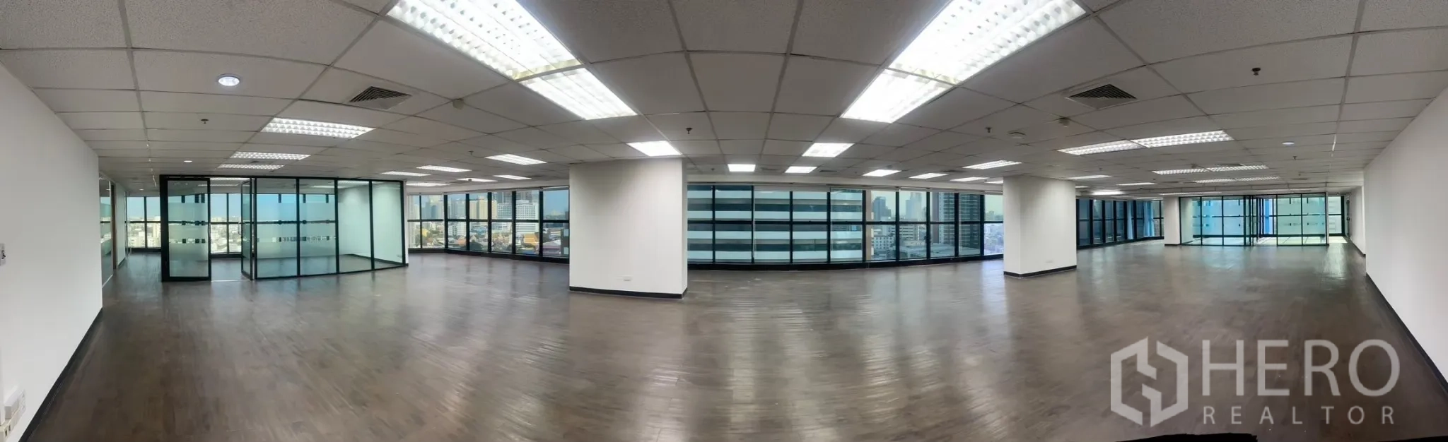 Office Space for rent in Watthana, Bangkok - Panoramic office floor with a long wall of windows bringing in natural light.