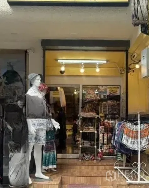 Retail Space for rent in Watthana, Bangkok - Storefront entrance with mannequin display, sliding glass door, ceiling lights and racks.