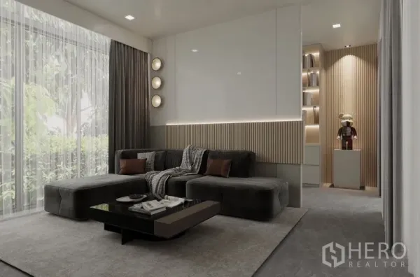 Detached House for rent in Saphan Sung, Bangkok - Ground‑floor family room with large sectional sofa, sheer drapes and garden outlook.