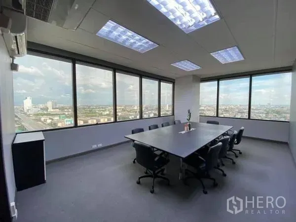 Office Space for rent in Bang Na, Bangkok - Corner meeting room with wide windows, skyline views and recessed ceiling lighting.