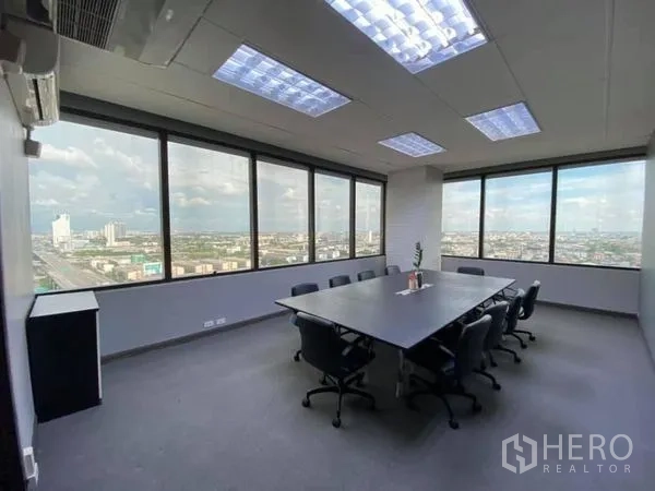 Office Space for rent in Bang Na, Bangkok - Corner meeting room with wide windows, skyline views and recessed ceiling lighting.