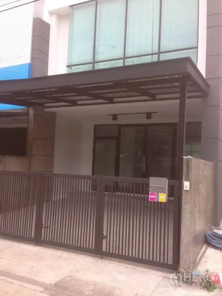 Home Office for rent in Bang Phli, Samut Prakan - Modern home office facade with glass frontage, metal gate and covered carport.