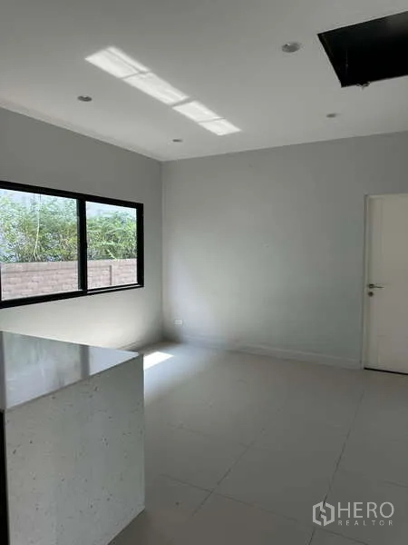 Detached House for sale in Lam Luk Ka, Pathum Thani - Minimalist dining nook with window and internal door.