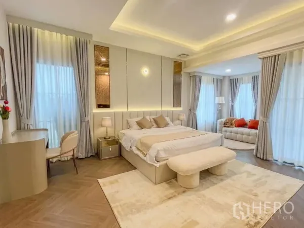 Detached House for rent in Saphan Sung, Bangkok - Spacious master suite with tray ceiling, seating area and full-height curtains.