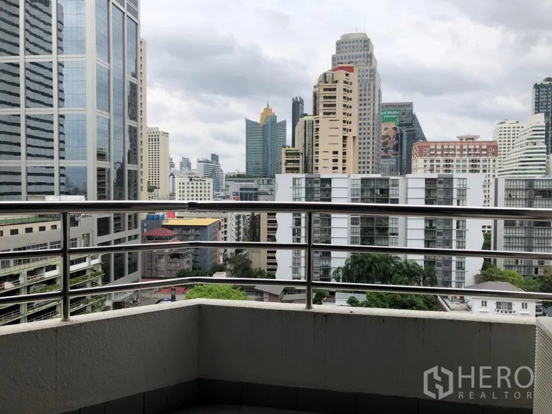 Condominium for rent in Khlong Toei, Bangkok - Private balcony overlooking the Sukhumvit skyline and high-rise buildings.