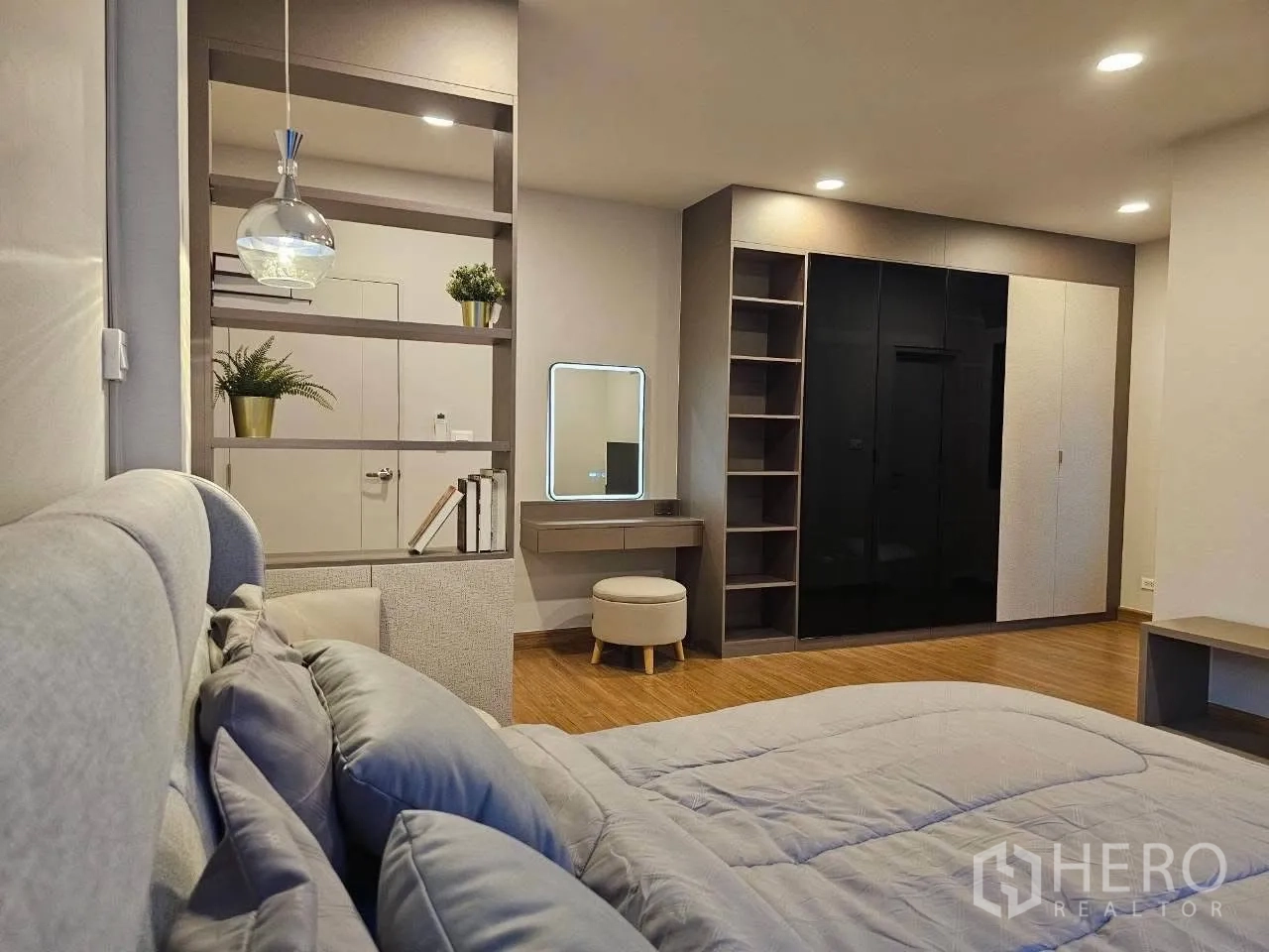 Detached House for rent or sale in Bang Phli, Samut Prakan - Master suite with bed, dressing table, and large wardrobe.
