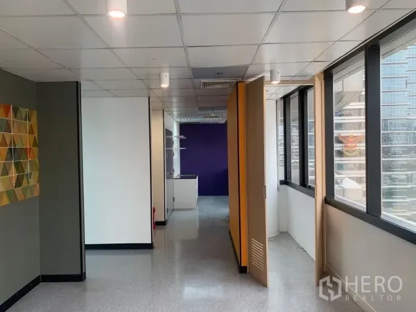 Office Space for rent in Bang Rak, Bangkok - Corridor workspace with large windows, folding partitions, and a pantry nook.
