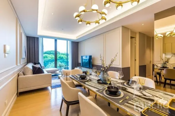 Condominium for rent in Pathum Wan, Bangkok - Dining area set for six with marble-top table, chandeliers, and balcony outlook.
