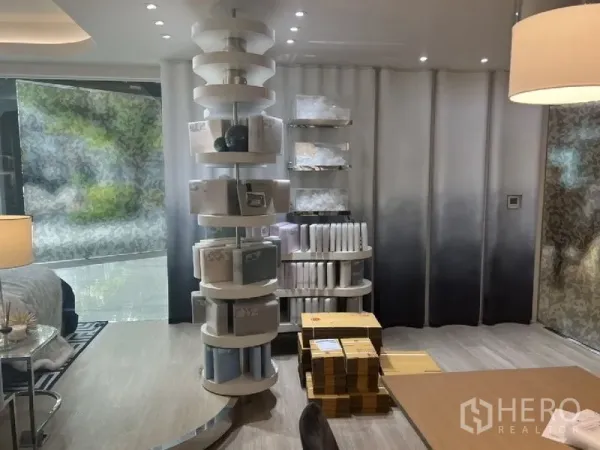 Retail Space for rent in Watthana, Bangkok - Interior retail space with round display tower, product shelving and warm lighting.