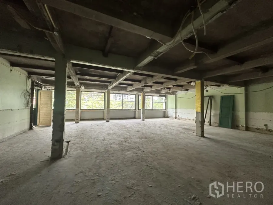 Office Space for rent in Bang Rak, Bangkok - Spacious 3rd-floor bareshell office with large windows and exposed concrete beams in Bang Rak.