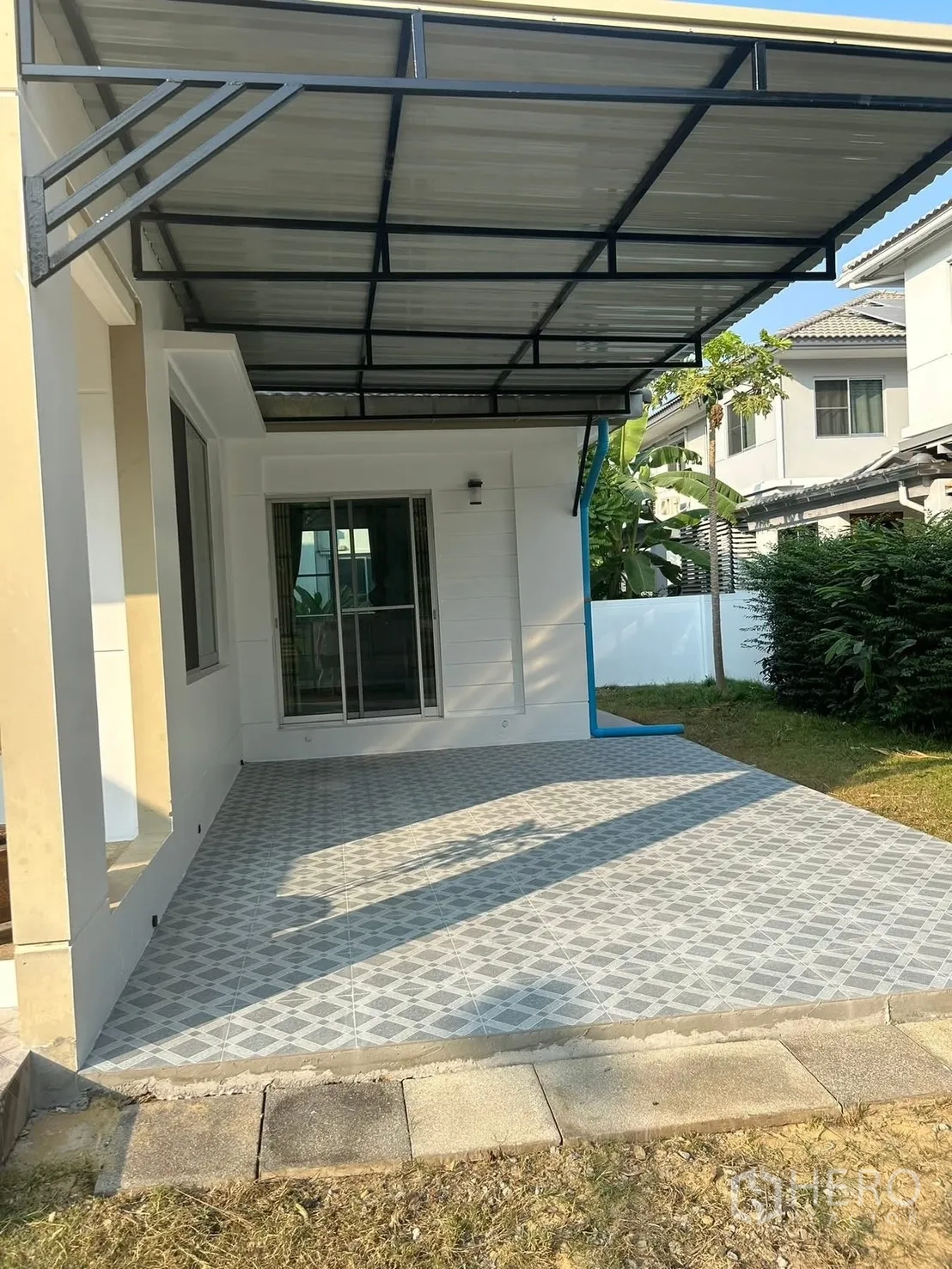 Detached House for rent in Bang Na, Bangkok - Covered terrace with tiled flooring connecting to sliding doors and garden.