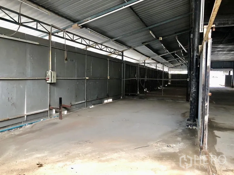 Office Space for rent in Suan Luang, Bangkok - Open-sided storage area with metal roof and power lines for light industrial use
