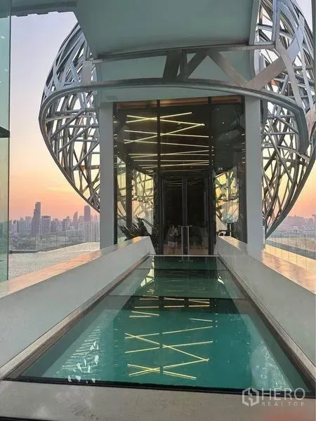 Condominium for rent - Rooftop sky-bridge water feature with Bangkok skyline views at the condominium facilities.