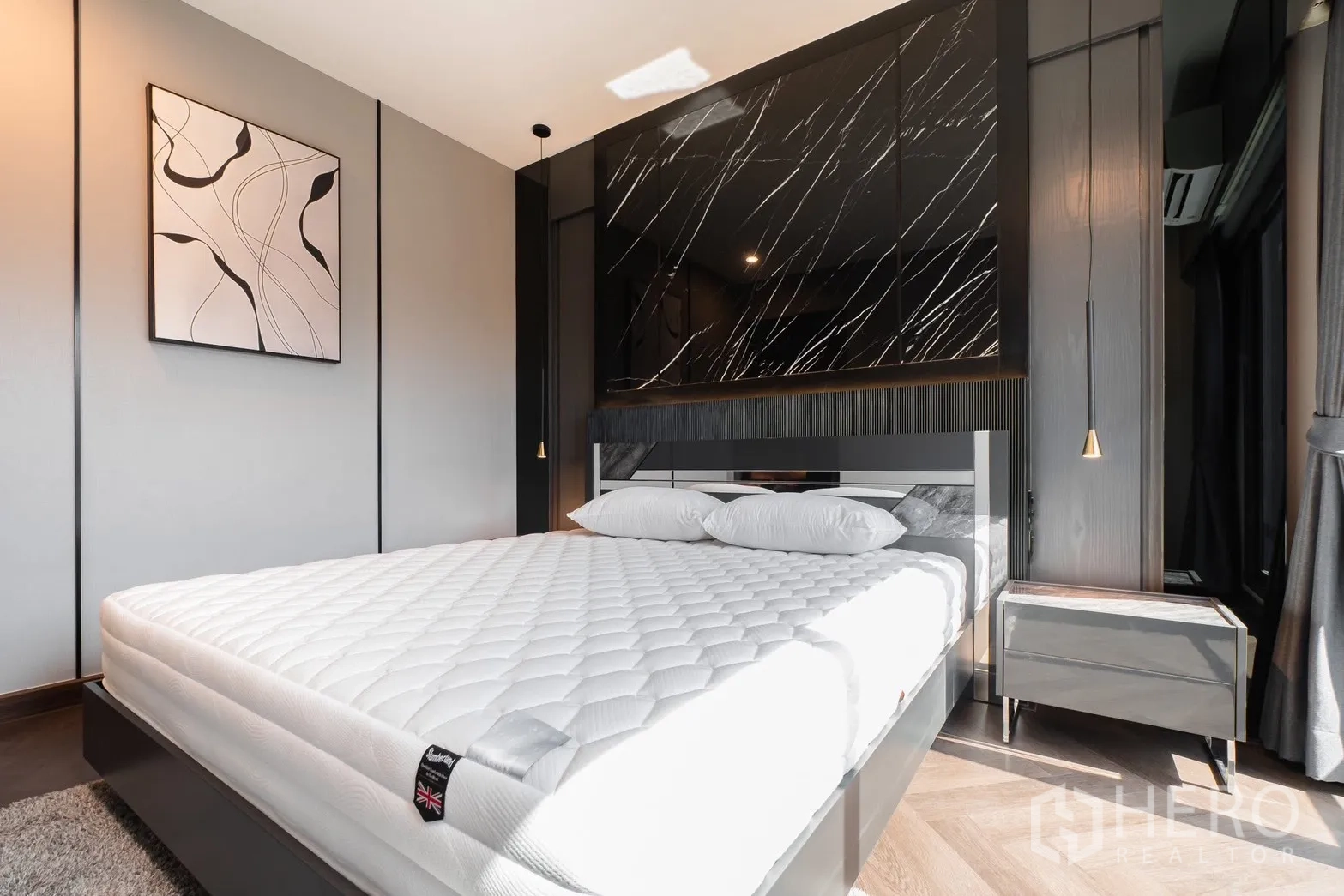 Detached House for rent or sale in Prawet, Bangkok - Master bedroom angle showing feature wall and bedside tables