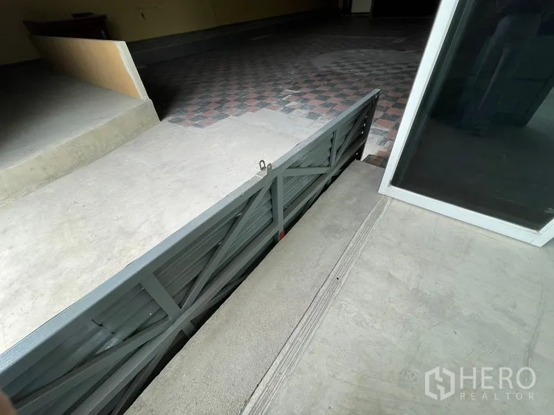 Warehouse for rent in Sam Phran, Nakhon Pathom - Loading dock ramp and recessed pit at the main warehouse entrance.