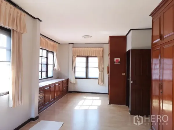 Detached House for sale - Sunlit corner room with multiple windows, built-in storage and wardrobes.