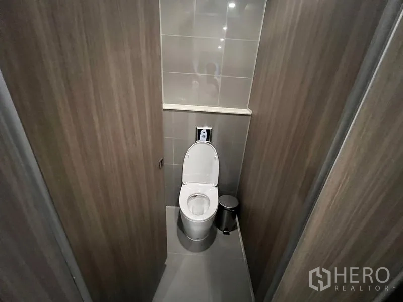 Office Space for rent - Private toilet cubicle with modern fixtures and neutral tones.