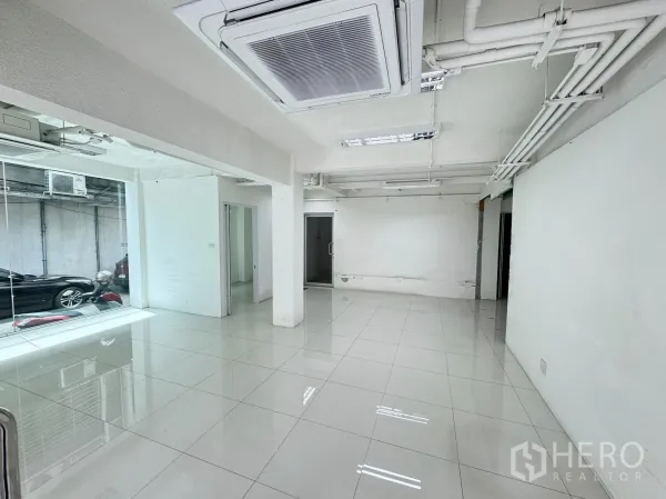 Retail Space for rent in Bang Rak, Bangkok - Bright open-plan retail interior with white tile floors, glass storefront, and ceiling cassette air conditioning.