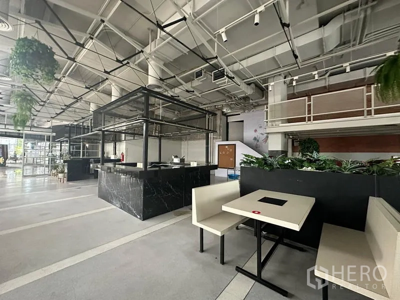Retail Space for rent in Watthana, Bangkok - Marble kiosks and booth seating arranged within a spacious retail hall.