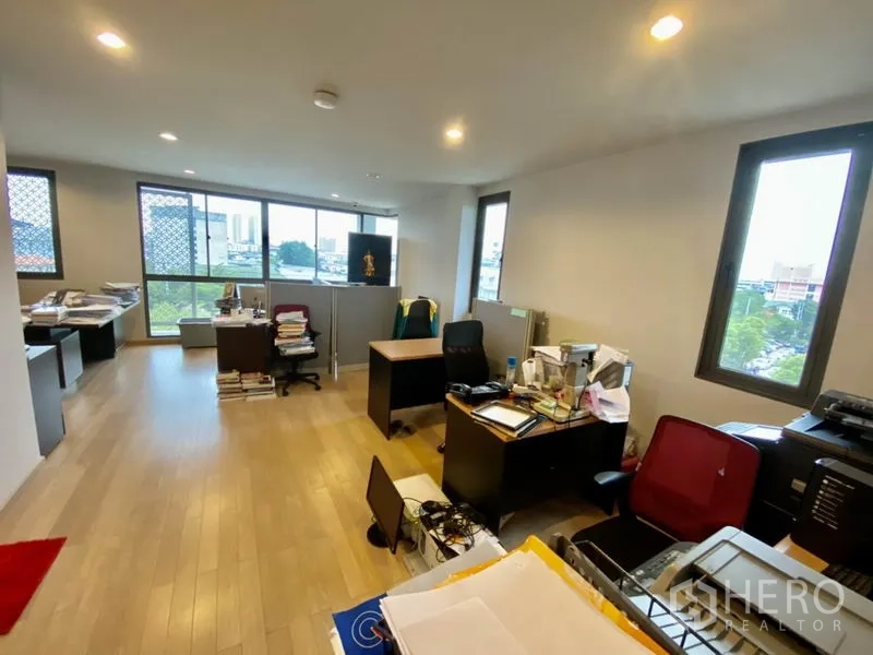 Home Office for rent or sale in Yan Nawa, Bangkok - Executive boardroom with an extra-long conference table, swivel chairs, and a glass partition.
