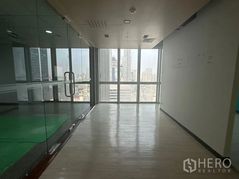 Office Space for rent in Bang Rak, Bangkok - Glass-enclosed meeting room with full-height windows overlooking Bangkok.
