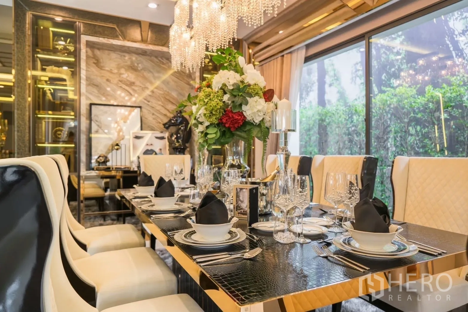 Detached House for rent in Prawet, Bangkok - Formal dining room with crystal chandeliers, garden view and an elegant table setting for eight