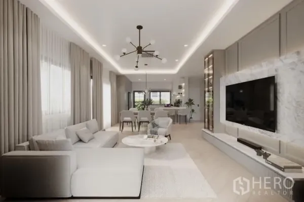 Detached House for rent in Bang Phli, Samut Prakan - Open-plan living and dining facing the kitchen and marble TV wall in a neutral palette.