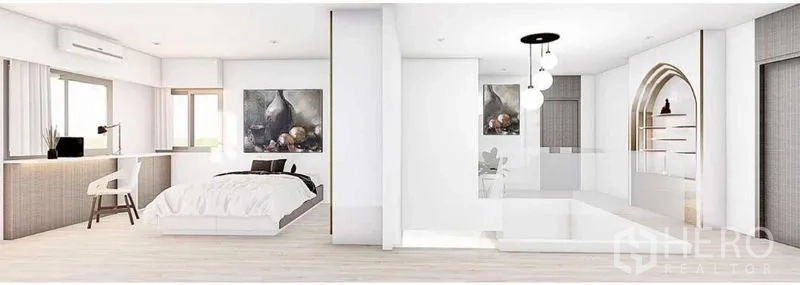 Detached House for rent in Lat Phrao, Bangkok - Spacious master suite with bed, study desk, arched niche shelving and contemporary lighting.