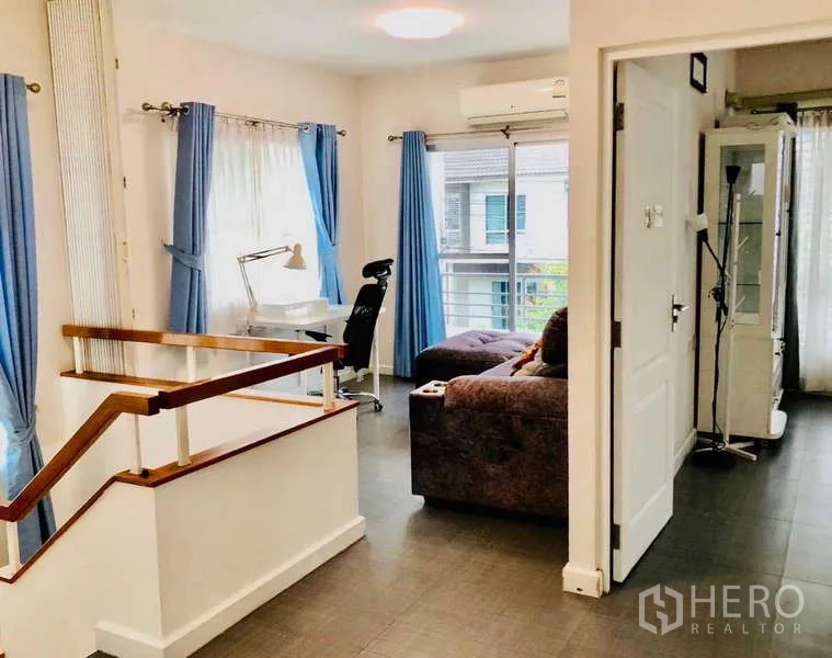 Detached House for rent or sale - Second-floor landing with workstation, sofa and balcony doors.