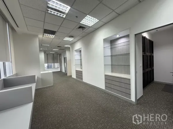 Office Space for rent in Watthana, Bangkok - Open-plan office with display shelving, overhead lighting and workstation counters.