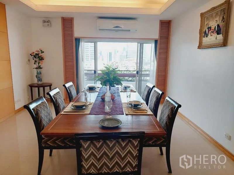 Apartment for rent - Dining area with eight-seat wooden table and skyline view from the window.