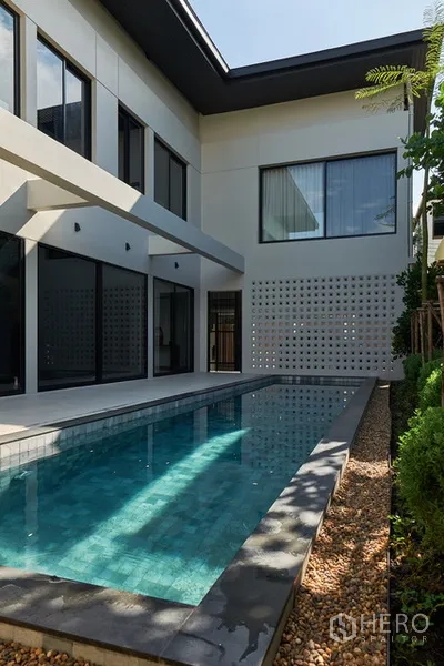 Detached House for rent in Watthana, Bangkok - Private lap pool in an enclosed courtyard beside floor-to-ceiling windows.