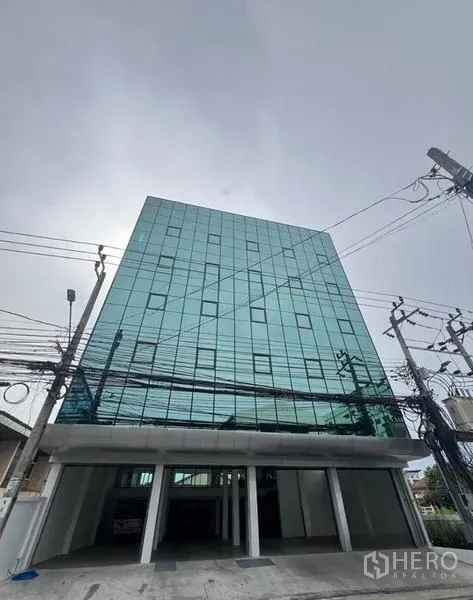Office Space for rent or sale in Wang Thonglang, Bangkok - Modern glass-front office building exterior in Wang Thonglang, Bangkok.
