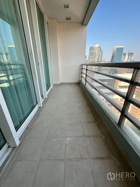 Condominium for rent in Bang Rak, Bangkok - Private balcony with tiled floor and skyline views over Silom.