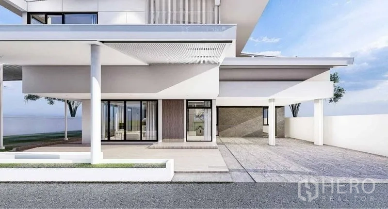 Detached House for rent in Lat Phrao, Bangkok - Covered carport and main entrance with columns, sliding glass doors and patio of a contemporary home.