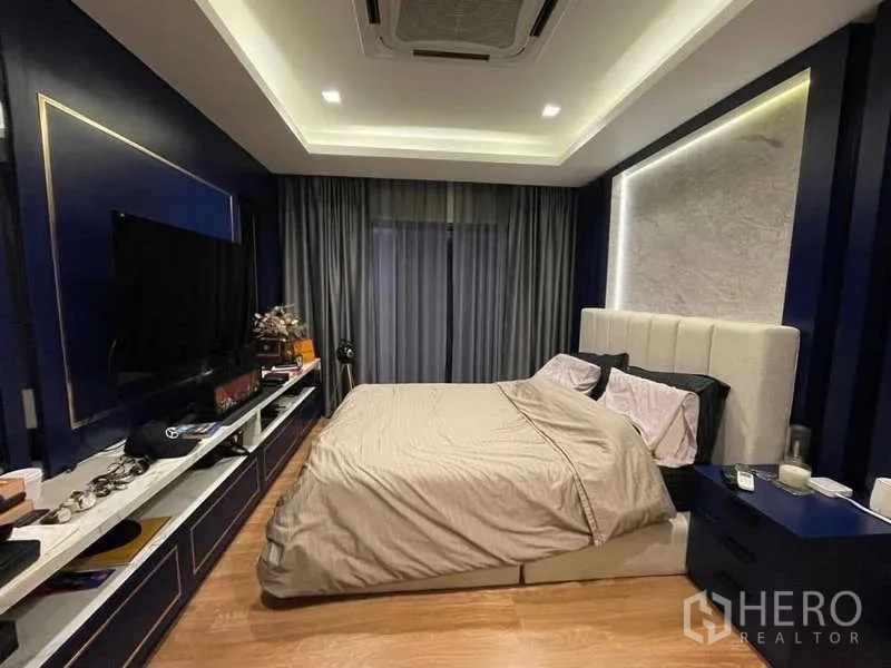 Detached House for rent - Full view of sleek kitchen with marble counters, grey cabinetry and large fridge.