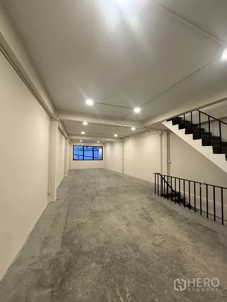 Shophouse for rent - Upper level mezzanine with dark ceiling and LED lights in the renovated shophouse.
