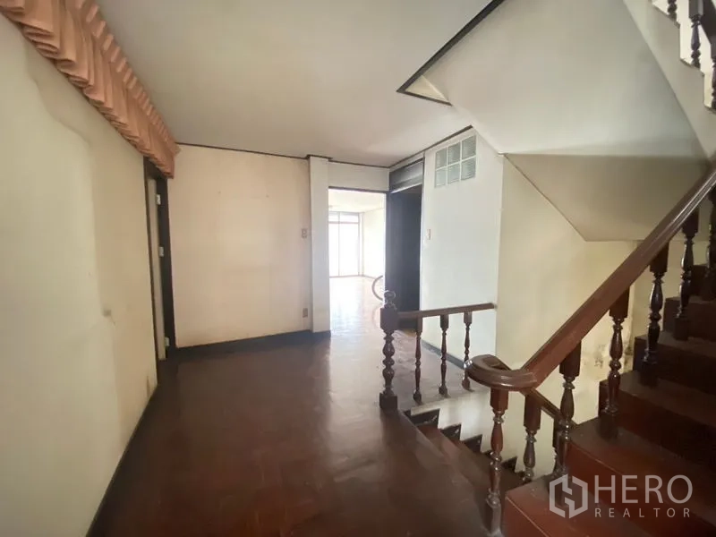 Retail Space for rent in Watthana, Bangkok - Upper-floor landing with wooden staircase and open space leading to rooms.