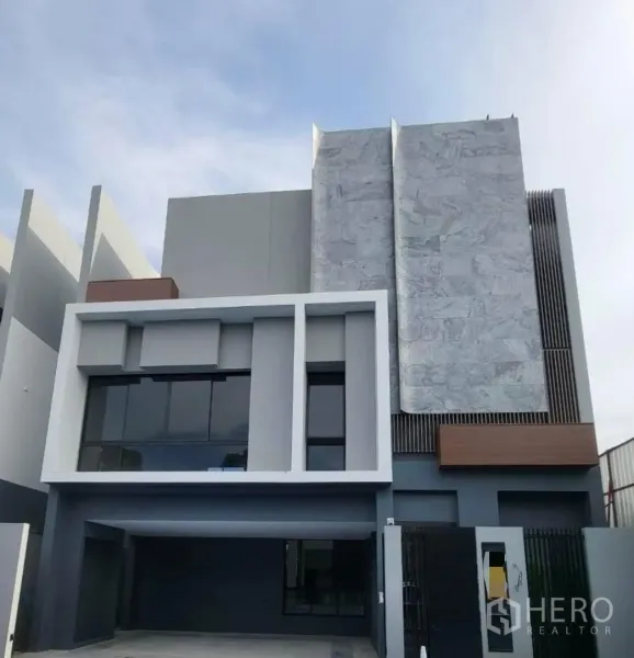 Detached House for rent - Modern three-storey detached house facade with geometric panels, large windows and a covered carport in Bang Kapi.