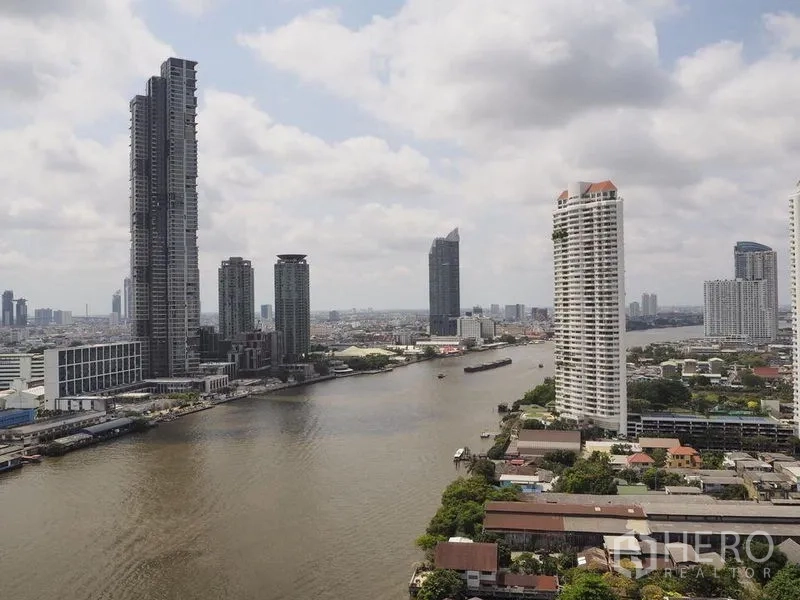 Condominium for rent in Khlong San, Bangkok - Panoramic view of the Chao Phraya River and Bangkok skyline from a high-floor condominium.