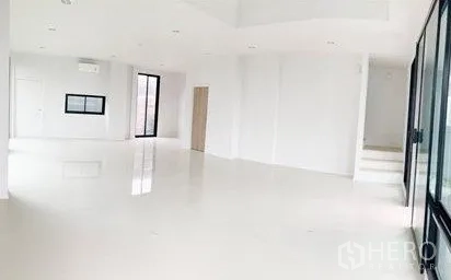 Home Office for rent in Don Mueang, Bangkok - Spacious open-plan ground floor with white flooring and wide windows.