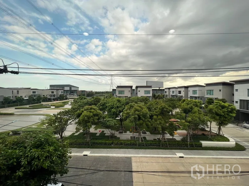 Detached House for rent in Saphan Sung, Bangkok - Upper-floor view over landscaped community park and modern houses.