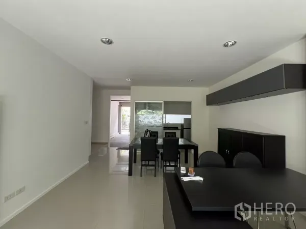 Townhouse for rent in Suan Luang, Bangkok - View from the rear toward the front showing dining space and the kitchen entry.