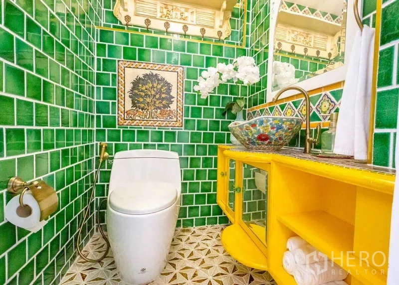 Townhouse for rent in Lat Phrao, Bangkok - Colorful powder room featuring green subway tiles, bold yellow vanity and patterned floor.