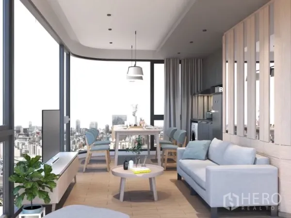 Condominium for rent or sale in Bang Rak, Bangkok - Bright living and dining area with wraparound glass, sofa and round coffee table overlooking the Bangkok skyline.