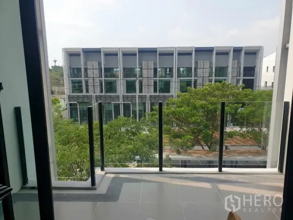 Home Office for rent - Balcony view across a tree-lined street to contemporary row home offices.